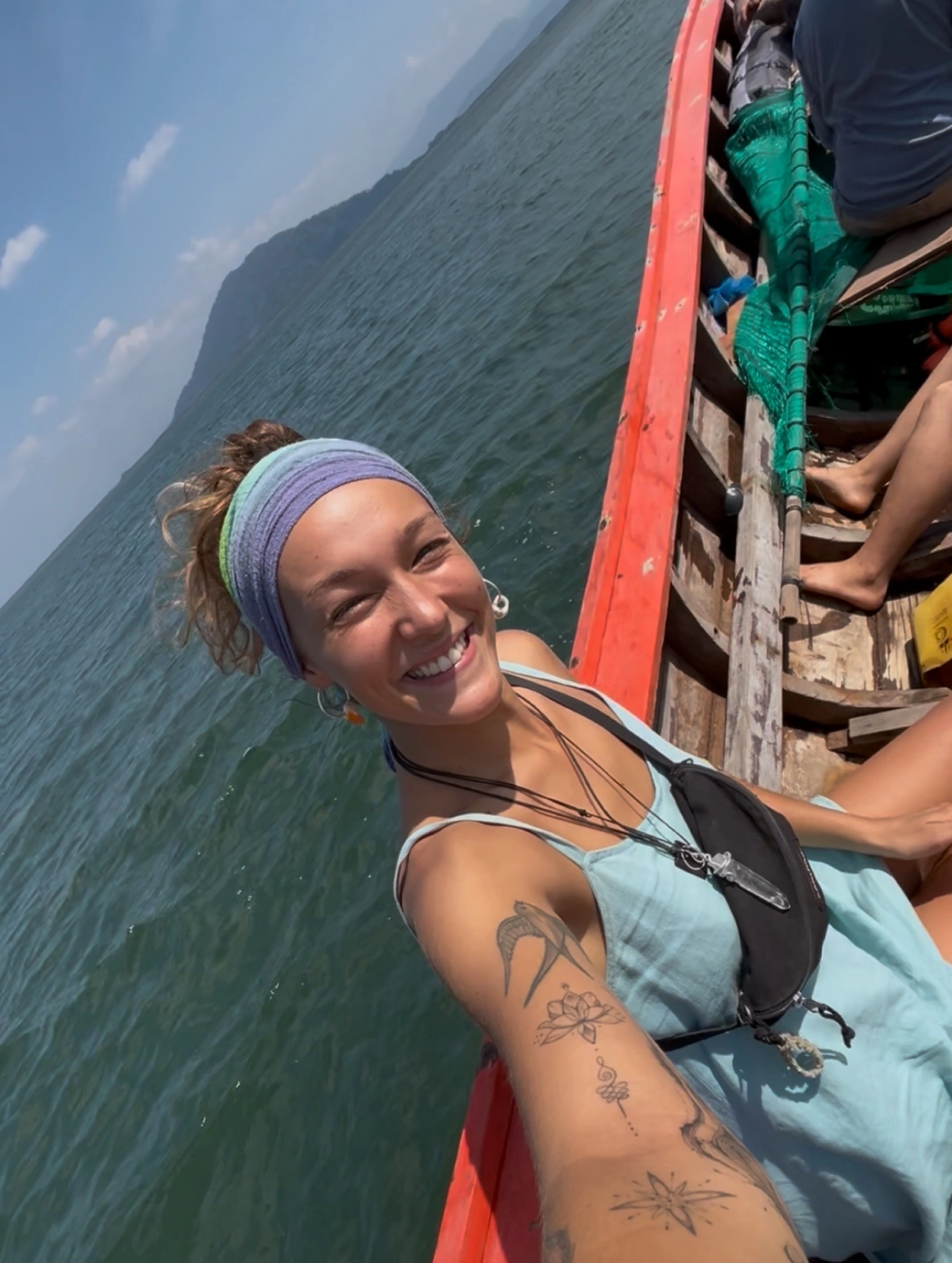 Nicole on a wooden boat in Thailand